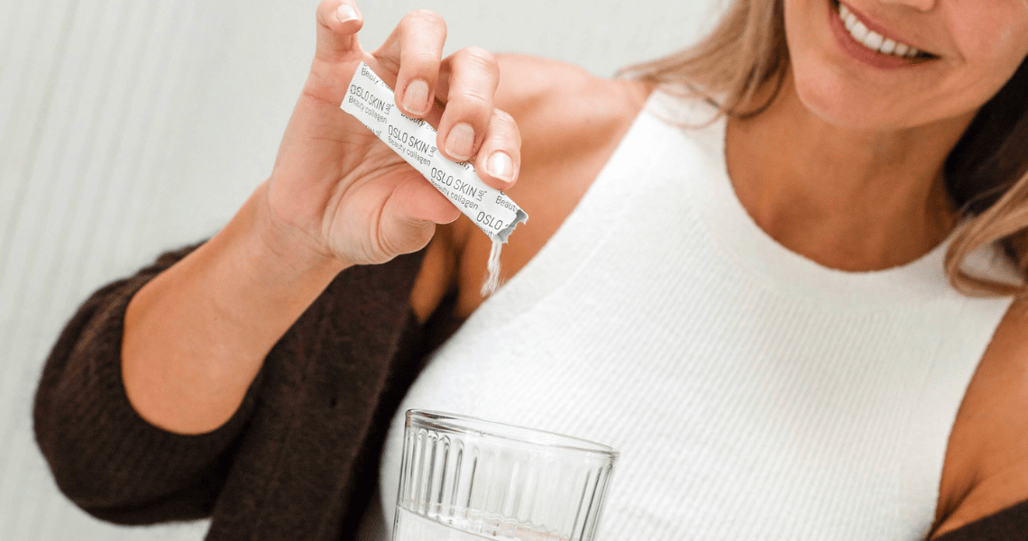 Closeup of a woman pouring The Solution in a glass